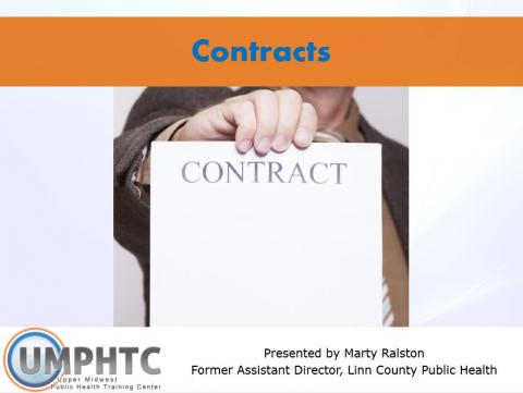 Photo of a hand, holding up a paper that says "Contract" in large letters