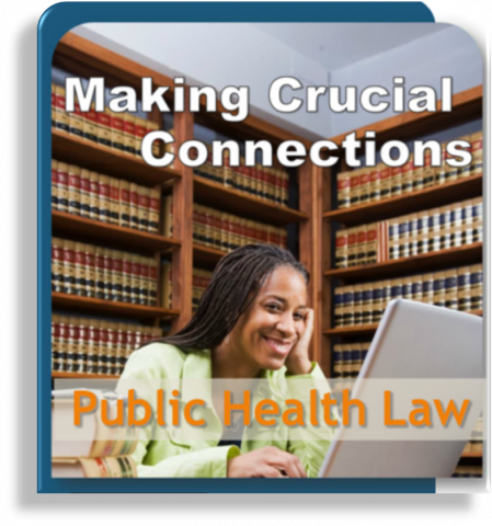 Smiling woman sitting in a law library in front of laptop
